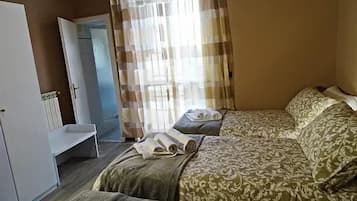 Desk, laptop workspace, free WiFi, bed sheets