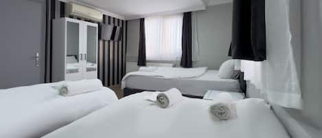 Comfort Quadruple Room | Premium bedding, iron/ironing board, free cribs/infant beds, free WiFi