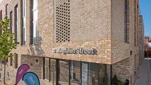 A building with a sign reading "27 Magdalen Street" and a "Host Welcome" sign outside. - For Student Only Magdalen Street at Colchester - Campus Accommodation (Colchester)