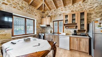 Fridge, oven, coffee/tea maker, cookware/dishes/utensils