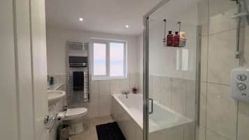 Separate tub and shower, deep soaking tub, hair dryer, towels