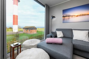 TV, books - BeltBlick 3 - Baltic Sea view. Sauna. Comfort for families. (Fehmarn)