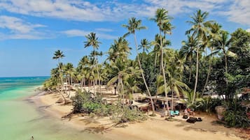 On the beach, sun loungers, beach towels