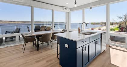Top floor end unit with covered porch overlooking Lake Pepin - Assigned Garage - Unit 305