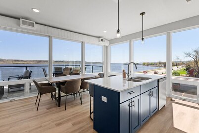 Top floor end unit with covered porch overlooking Lake Pepin - Assigned Garage - Unit 305