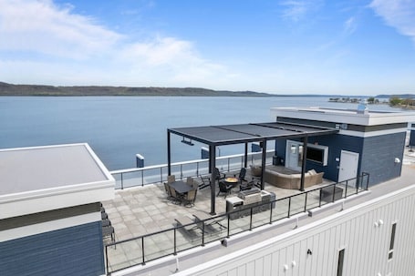 Outdoor dining. Top floor unit with huge patio overlooking Lake Pepin - Unit 304