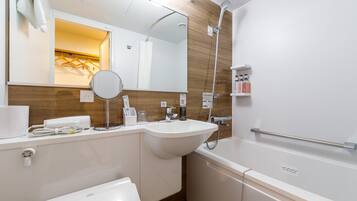 Bathtub, hair dryer, slippers, bidet