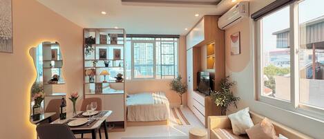 Hypo-allergenic bedding, desk, laptop workspace, blackout curtains