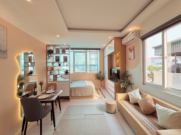 Hypo-allergenic bedding, desk, laptop workspace, blackout curtains