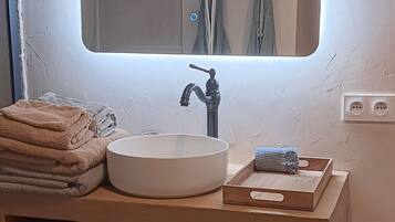 Shower, hair dryer, towels, toilet paper