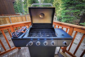 Enjoy al fresco dining with a gas grill and control panel on the outdoor deck.