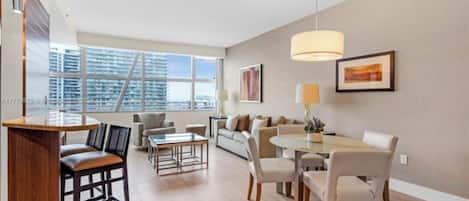 Luxury Apartment, City View | Living area | Flat-screen TV