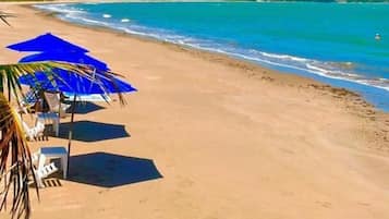 On the beach, black sand, beach bar