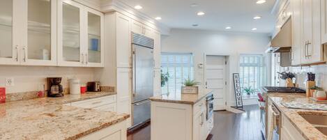 Fridge, stovetop, dishwasher, coffee/tea maker