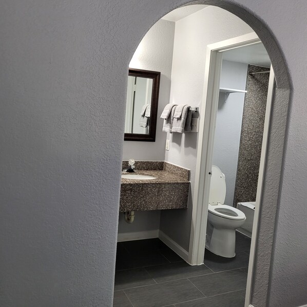 Economy Room, 2 Queen Beds, Balcony, Garden View | Bathroom - 2 queen beds hotel studio 107 Hot tub (Livingston)