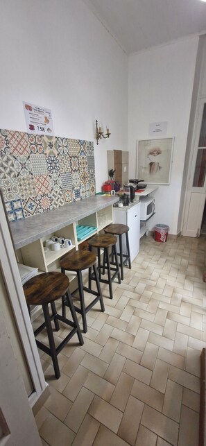 Mini-fridge, microwave, stovetop, cookware/dishes/utensils