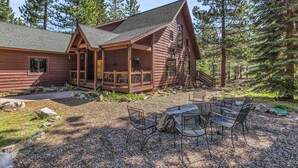 A rustic cabin with a porch, a fire pit, and outdoor seating. - Beautiful 3 Bedroom Mountain Paradise near Lake Davis (Portola)