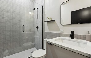 Shower, towels, soap, toilet paper