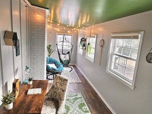 Updated 4-bedroom house with relaxing sunroom; minutes from downtown Raleigh.