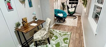 Updated 4-bedroom house with relaxing sunroom; minutes from downtown Raleigh.