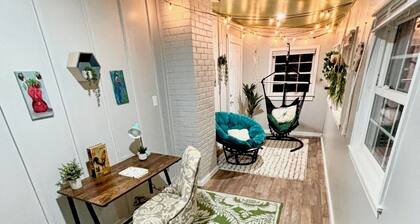 Updated 4-bedroom house with relaxing sunroom; minutes from downtown Raleigh.