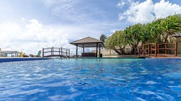 Outdoor pool, free pool cabanas, pool umbrellas