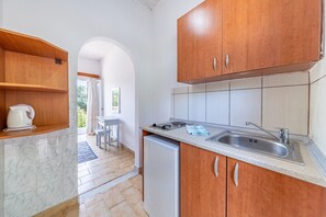 Fridge, stovetop, electric kettle, high chair