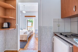 Fridge, stovetop, electric kettle, high chair