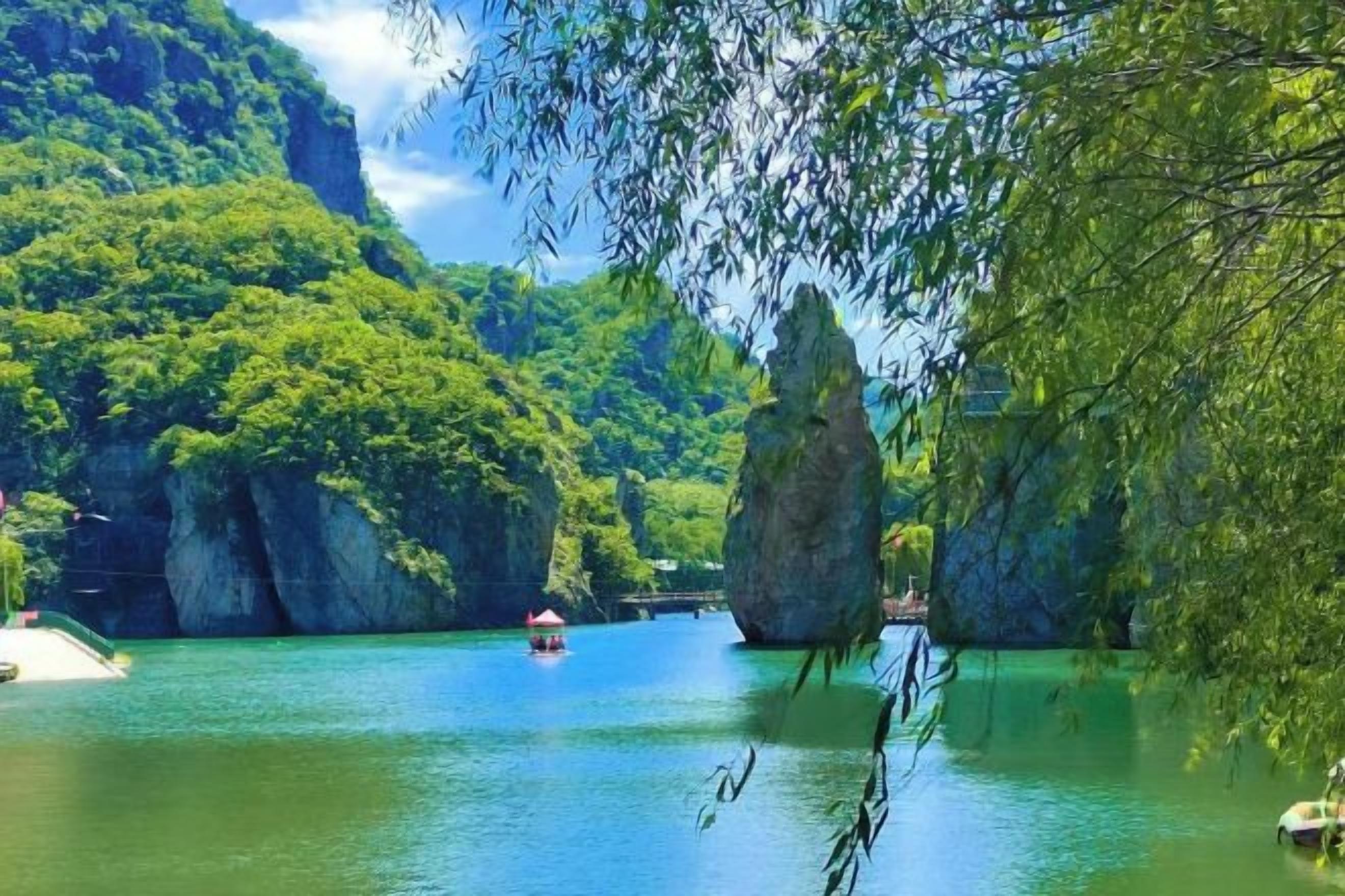 A river with rock formations and a boat.
