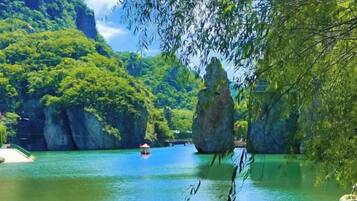A river with rock formations and a boat.