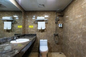 A bathroom with a marble sink, a toilet, and a shower. There are towel racks on the wall. - Libo Dapeng Business Hotel (Libo Ancient Town) (Libo)
