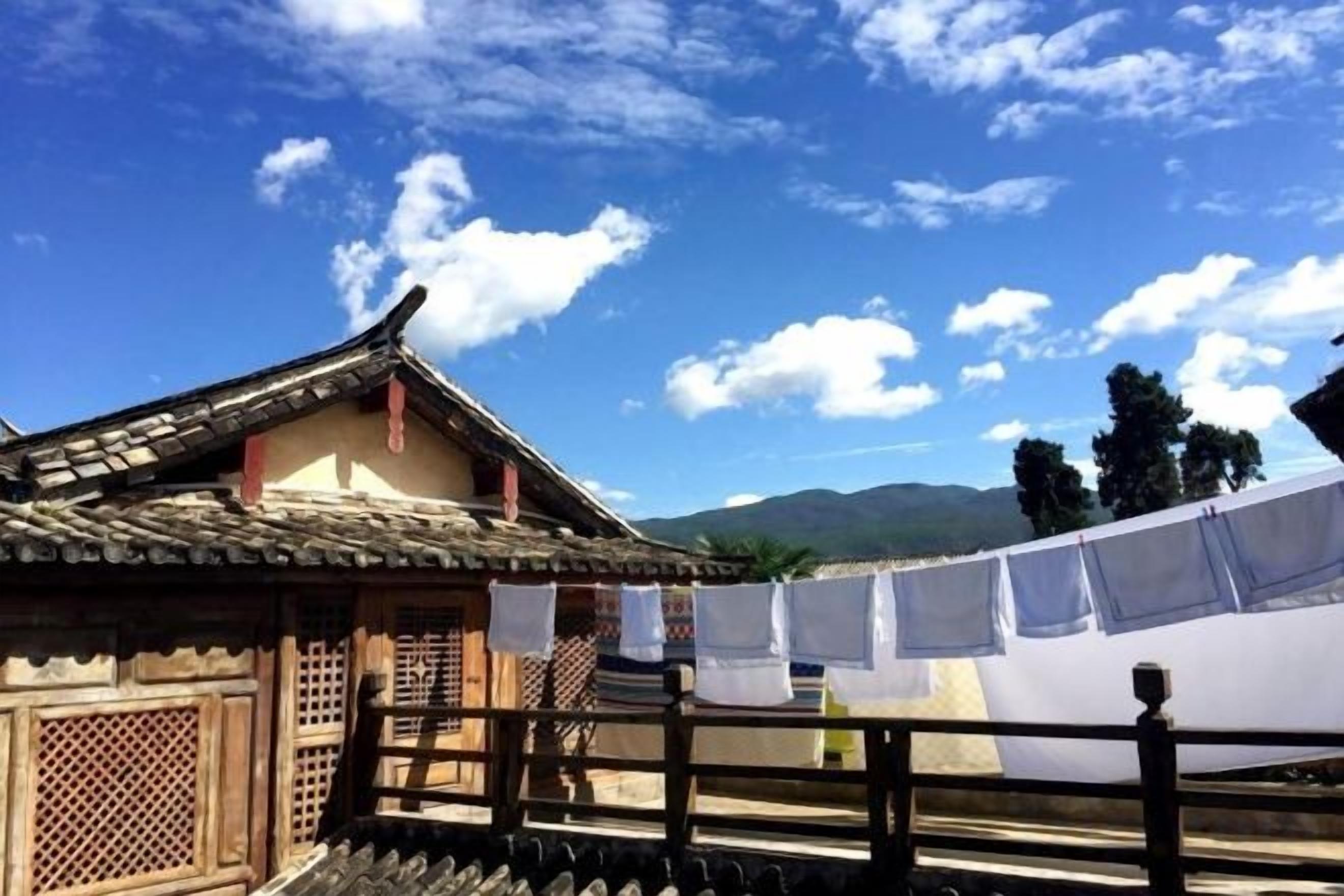 A traditional building with a tiled roof and wooden lattice windows.