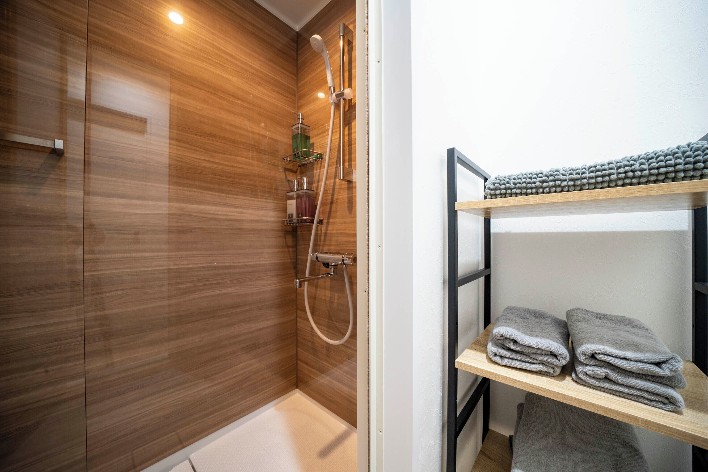 Shower, free toiletries, hair dryer, slippers