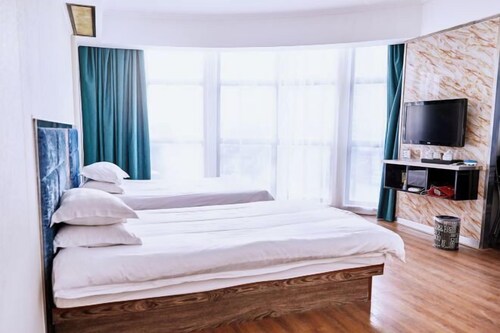 Linhai Tailong Business Hotel (Duqiao Babylong Plaza)