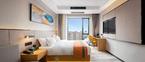 A modern hotel room with a large bed, a desk, a chair, a TV, and a view of the city.
