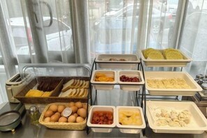 A breakfast buffet with various food items and containers. - Homeinn Hotel (Fushun Wanghua Leifeng Memorial Hall) (Fushun)