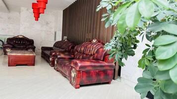 A living room with a sofa set, a coffee table, and a side table.