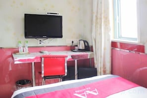 A room with a bed, a desk with a chair, a television, and a window. - AA Room Hotel (Shanghai Donglin Temple) (Shanghai)