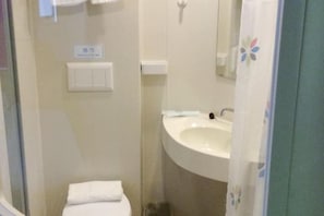 A small bathroom with a toilet, a sink, and a mirror. There is a sign above the toilet and a towel hanging on the wall. - 100 Inn (Shanghai Pudong Lingang University Town store) (Shanghai)