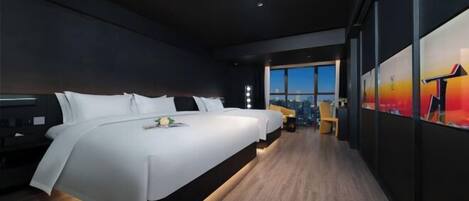 A modern hotel room with a large bed, a desk, and a view of the cityscape.