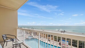 A balcony with a view of the beach and a swimming pool. - Sunsets on the Gulf!  2nd Floor unit.  Available dates 8/22 - 8/31/26 (Panama City Beach)