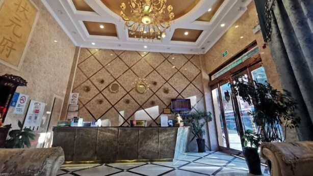 A hotel lobby with a reception desk, a chandelier, and a tiled floor. - Hanting Hotel (Linchuan No. 2 Middle School) (Fuzhou)
