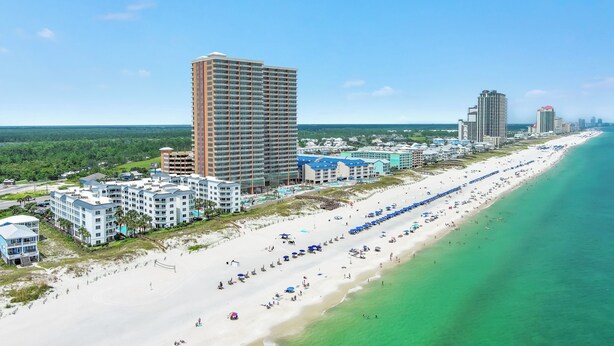 A coastal hotel with multiple buildings, a beach, and a clear view of the ocean. - BEACHFRONT RESORT, FAMILY FRIENDLY, TOP AMENITIES (Orange Beach)