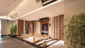 A traditional Japanese-style interior with a wooden walkway, a stone lantern, and bamboo plants. - Yihaoquan Piaofu Hot Spring Hotel (Lujiang)