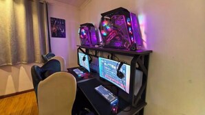 A gaming setup with two monitors, a keyboard, and a mouse.