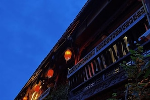 A building with multiple balconies and traditional lanterns. - Jiezi Ancient Town Old Manor (Chongzhou)