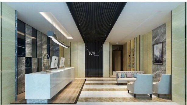 A reception area with a reception desk, seating area, and a wall with the logo 'KW'. - Kaiwang Hotel (Nanjing Mingguo Subway Station Military General Hospital) (Nanjing)