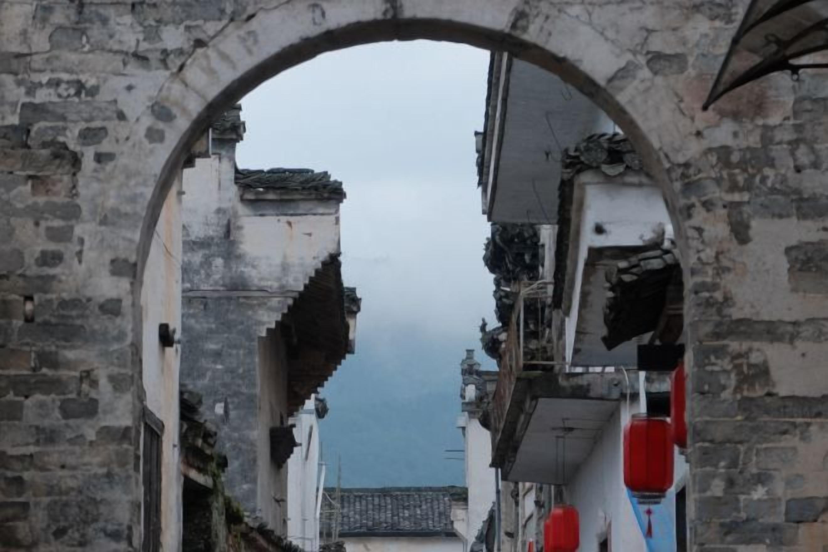 An arched stone structure with a narrow passageway.