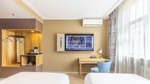 A hotel room with two beds, a desk, a TV, and a wardrobe. - Homeinn · neo (Jiuquan West Street Bus Station) (Jiuquan)