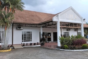 A building with a white facade and a red-tiled roof, named 'Lielá.' - Lilla Summer Retreat @ Bentong (Karak)